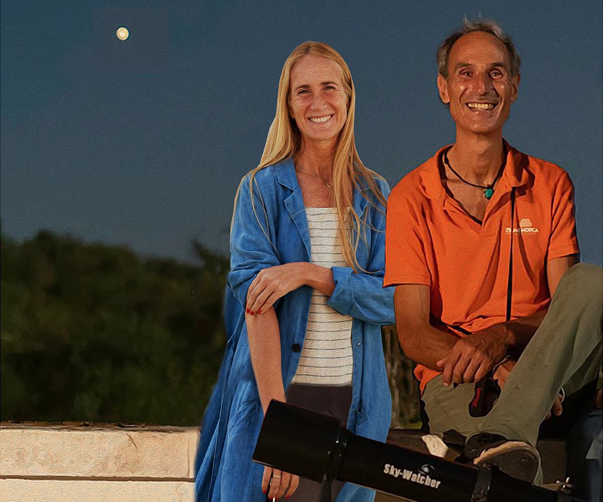 Javier Ares and Cristine Bedfor with a full moon in the background.