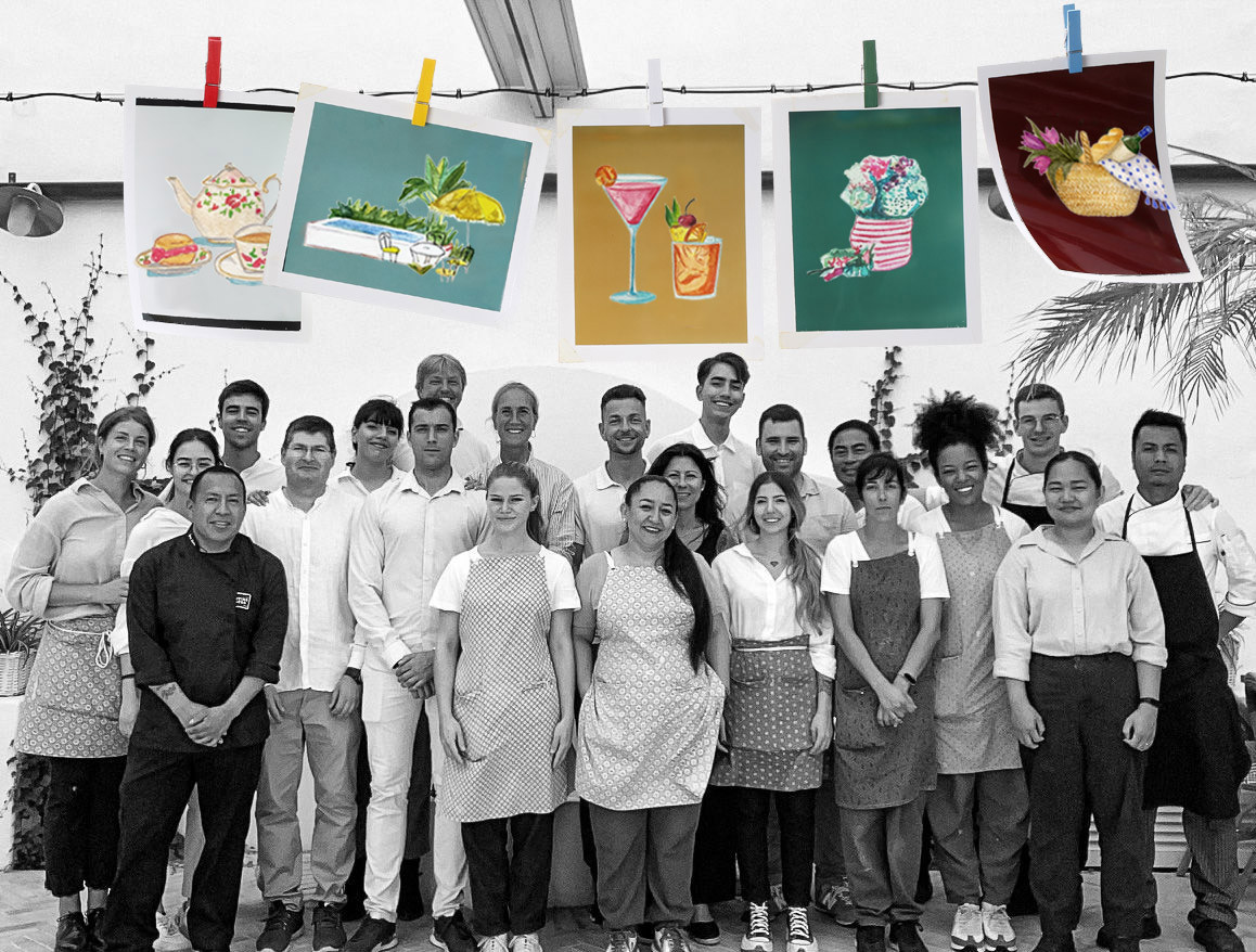 Cristine Bedfor Guest Houses employees smiling looking at camera with colorful signs.